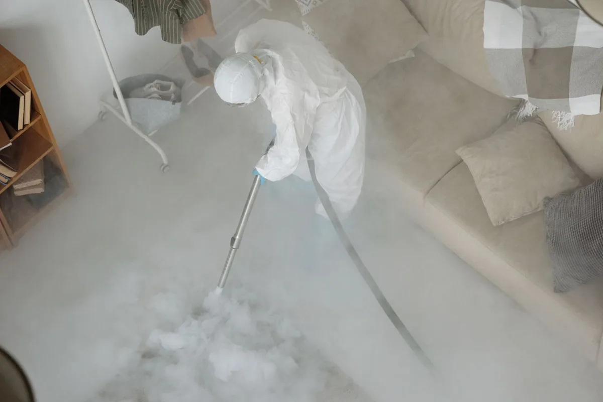 Biohazard cleanup technician in protective equipment, Englewood, NJ
